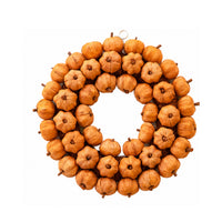 A circular autumn wreath made of many small dried orange pumpkins or gourds arranged in a ring, with a small metal hanging loop at the top, shown on a plain white background.