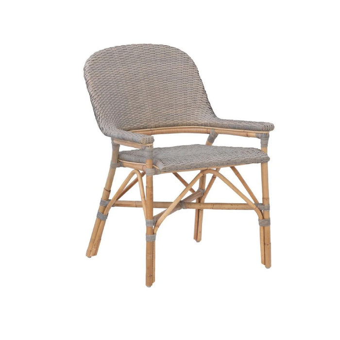 The Kenian Newport Beach Fog Gray Dining Chairs (set of 2) feature a curved back, armrests, and a light wood frame.