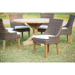 Brown wicker chair with white cushion