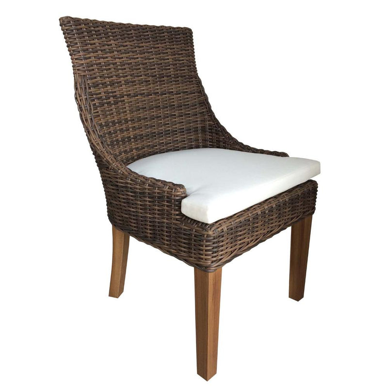 Brown wicker chair with white cushion