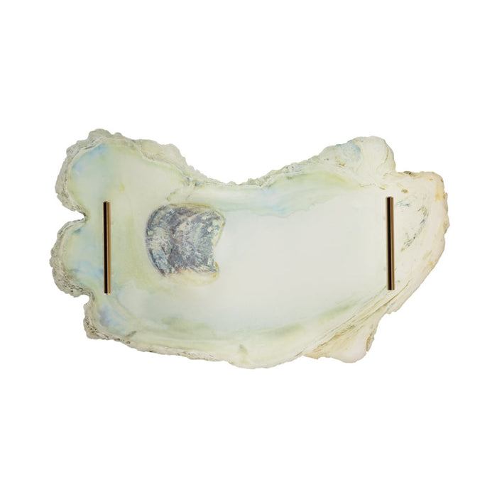 Opal stone with a central dark spot on a white background