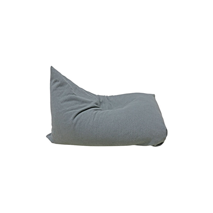 A soft, gray Lorena Canals 'Big Puff Emily' floor cushion with a relaxed shape, seen from the side.