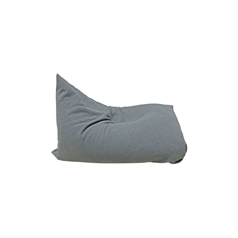 A soft, gray Lorena Canals 'Big Puff Emily' floor cushion with a relaxed shape, seen from the side.