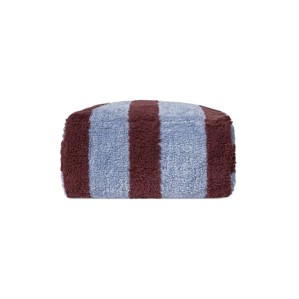 A rectangular, plush pouf with vertical stripes in dusty blue and dark brown, shown against a plain white background.