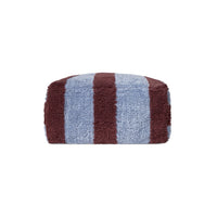 A rectangular, plush pouf with vertical stripes in dusty blue and dark brown, shown against a plain white background.