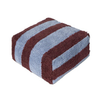 A folded plush pouf with alternating horizontal stripes of dusty blue and dark burgundy, shown on a solid white background.