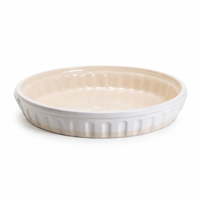 Ceramic pie dish with ribbed texture on a white background