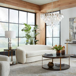 contemporary side table round walnut veneer top lower shelf antique gold columns