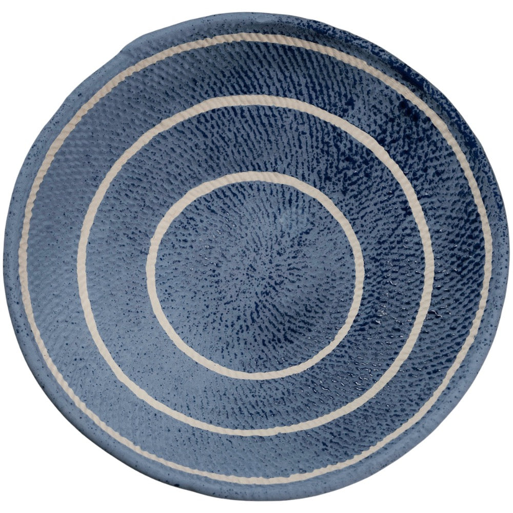 blue ceramic bowl off white circular stripes
