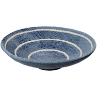 blue ceramic bowl off white circular stripes