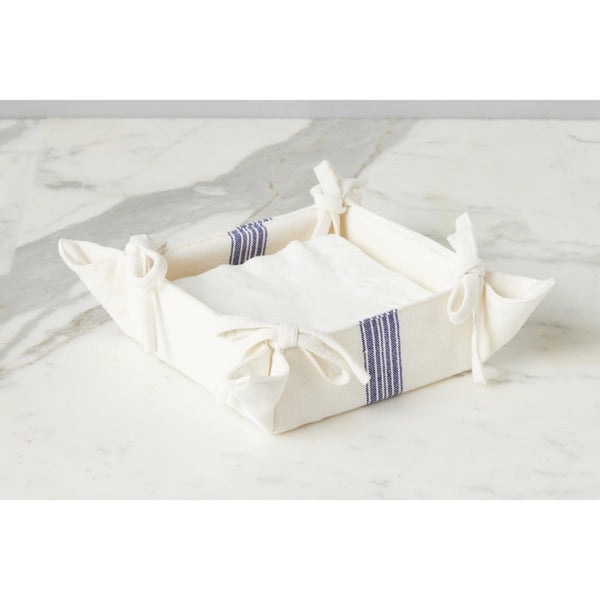 Fabric napkin tray with ties on a marble surface