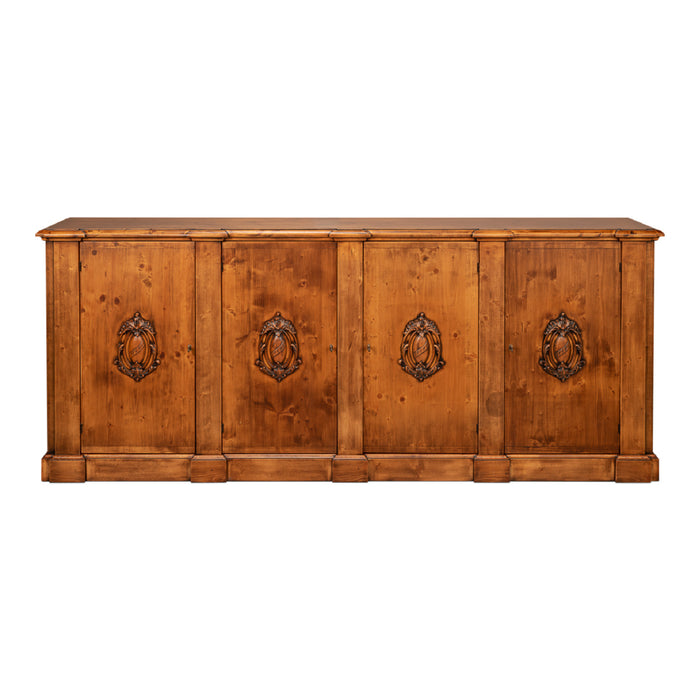 A rustic four-door wooden sideboard or credenza with a warm honey-brown finish and dark metal lion head pulls, shown against a plain white background.
