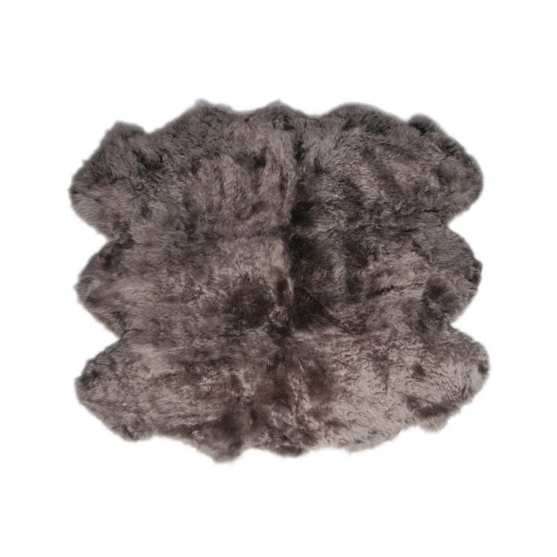 Gray Auskin Natural Longwool Sheepskin Rug made from organic lambskin fibers on a white background.
