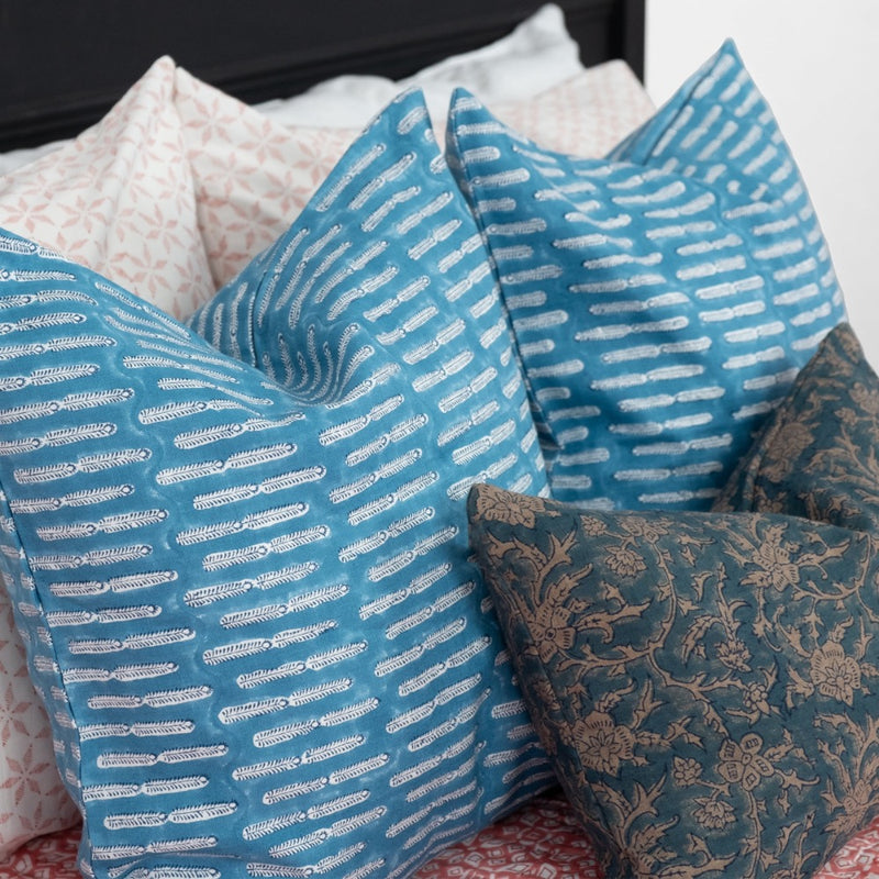 linen navy square pillow on bed