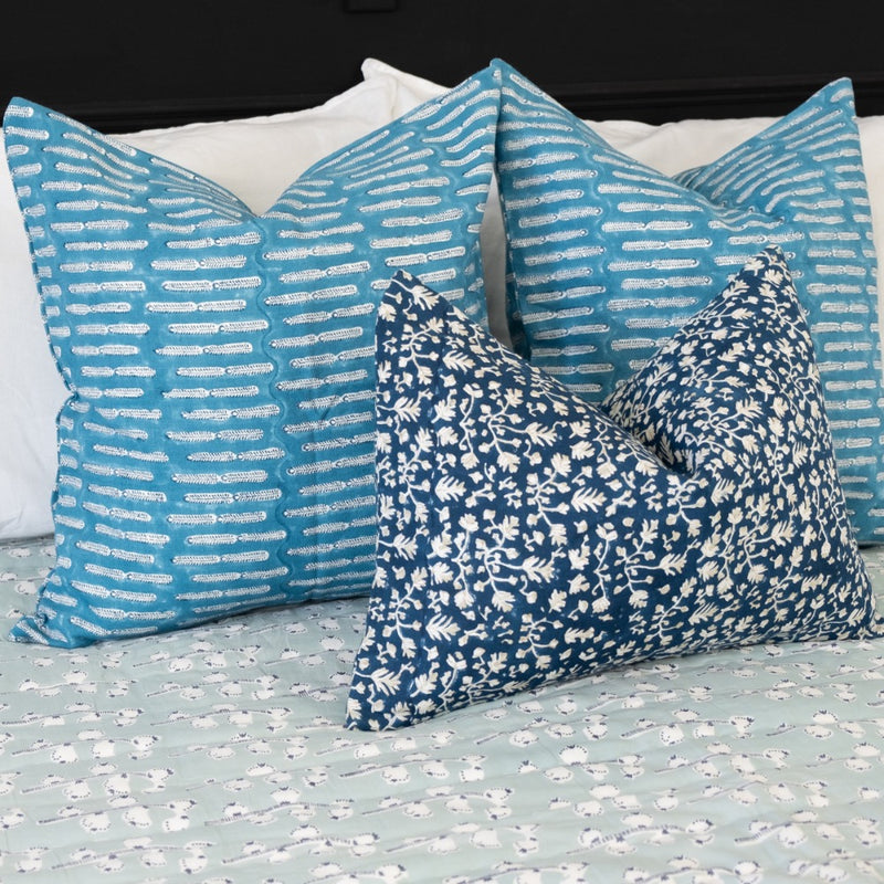 navy pillow square on bed