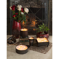 black round textured candle 4 wick 