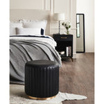 round black leather chanel stitched upholstered ottoman brass rim