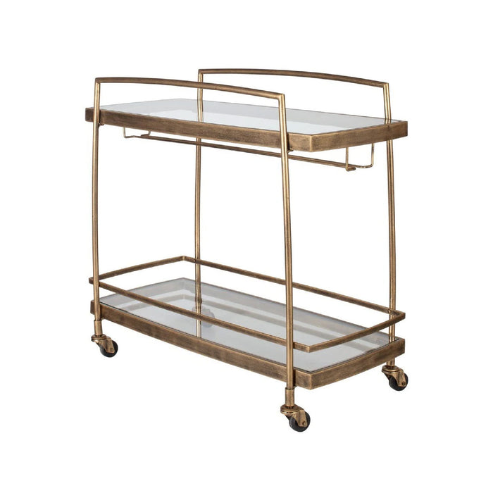 The Uttermost Scarritt Bar Cart features glass shelves, wheels, and antique brass finish—serve drinks in style.