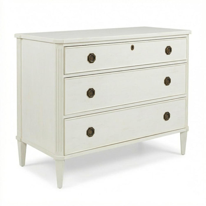 White dresser with three drawers and dark knobs on a white background