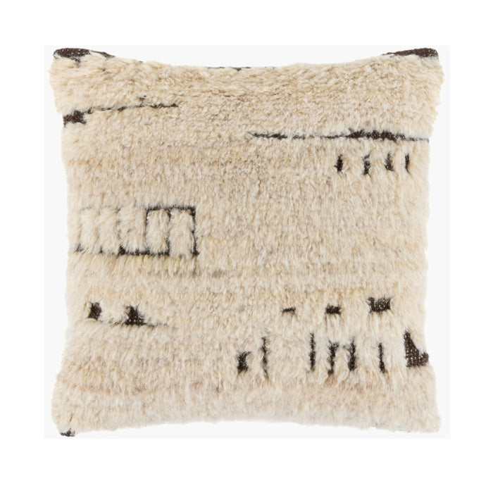 A square shaggy throw pillow in cream beige with dark brown abstract woven patterns, shown against a plain white background.