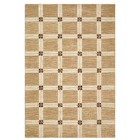A rectangular area rug with a woven natural jute texture, featuring a cream-colored grid pattern and small brown decorative accents at the intersections of the grid.