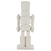 A white woven rattan nutcracker figurine standing on a rectangular base against a plain white background.