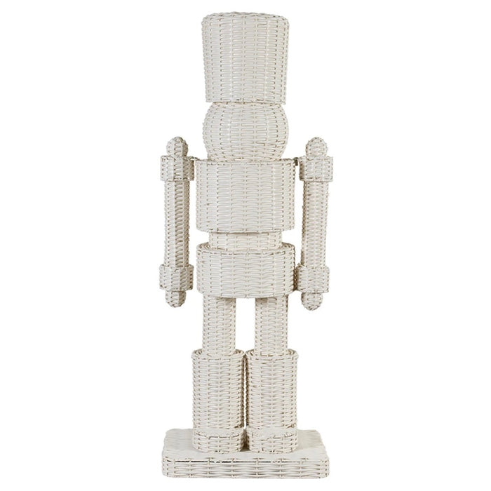 A white woven rattan nutcracker figurine standing on a rectangular base against a plain white background.