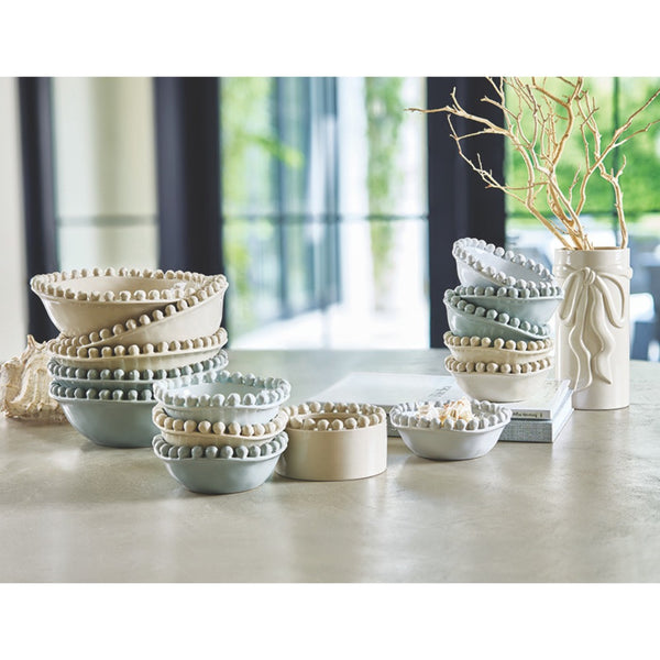 Set of decorative ceramic bowls on a table with a blurred indoor background