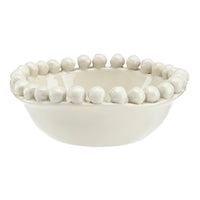 Off White ceramic bowl with bead-like embellishments on a white background