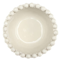 Off White ceramic bowl with bead-like embellishments on a white background