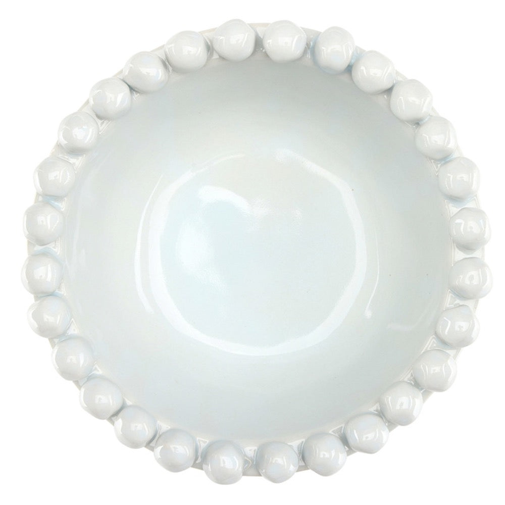 White ceramic bowl with bead-like edge on a white background