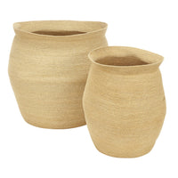 Two beige woven baskets on a white background