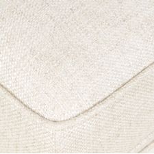 Close-up of cream-colored textured fabric with a corner seam, resembling Phillips Scott's Margo Cane Back Chair upholstery.
