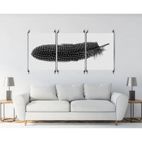 The "Triptych Longhorns Photography Art" from Barloga Studios commands attention above the white sofa, framed in archival wood and perfectly paired with two gray lamps on sleek side tables.