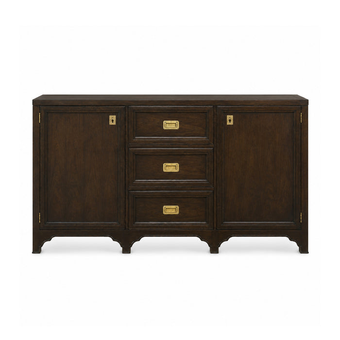 The Tucker Walnut Cabinet by Woodbridge Furniture features brass handles, two cabinets, and three drawers.