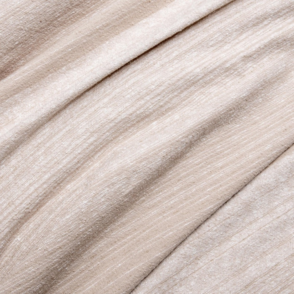 Close-up of beige fabric with a soft texture