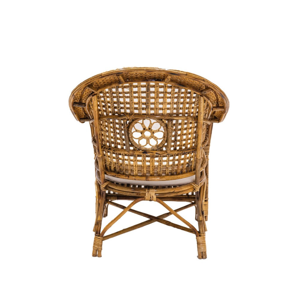 Wicker chair with a decorative backrest on a white background