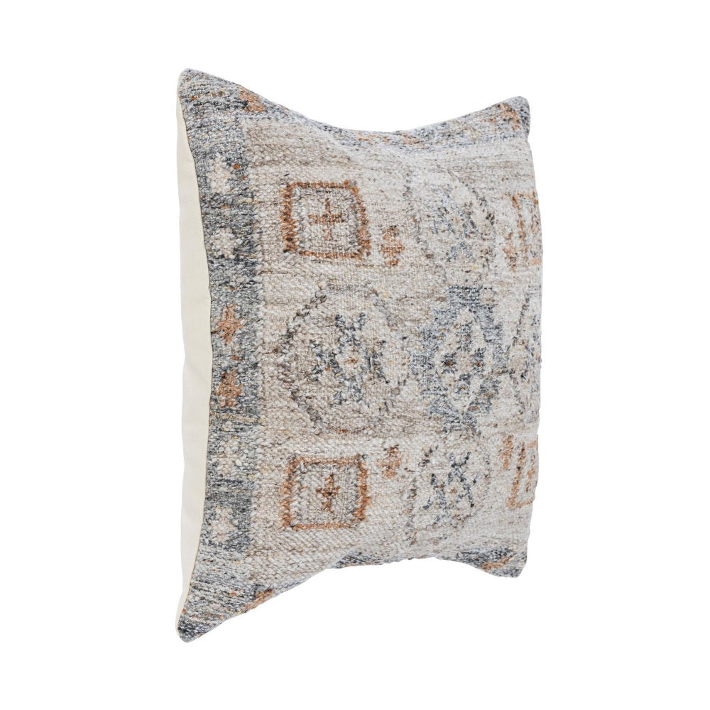 The Classic Home Outdoor Performance Lukens Pillow features a kilim-inspired textured front in beige, gray, and rust.