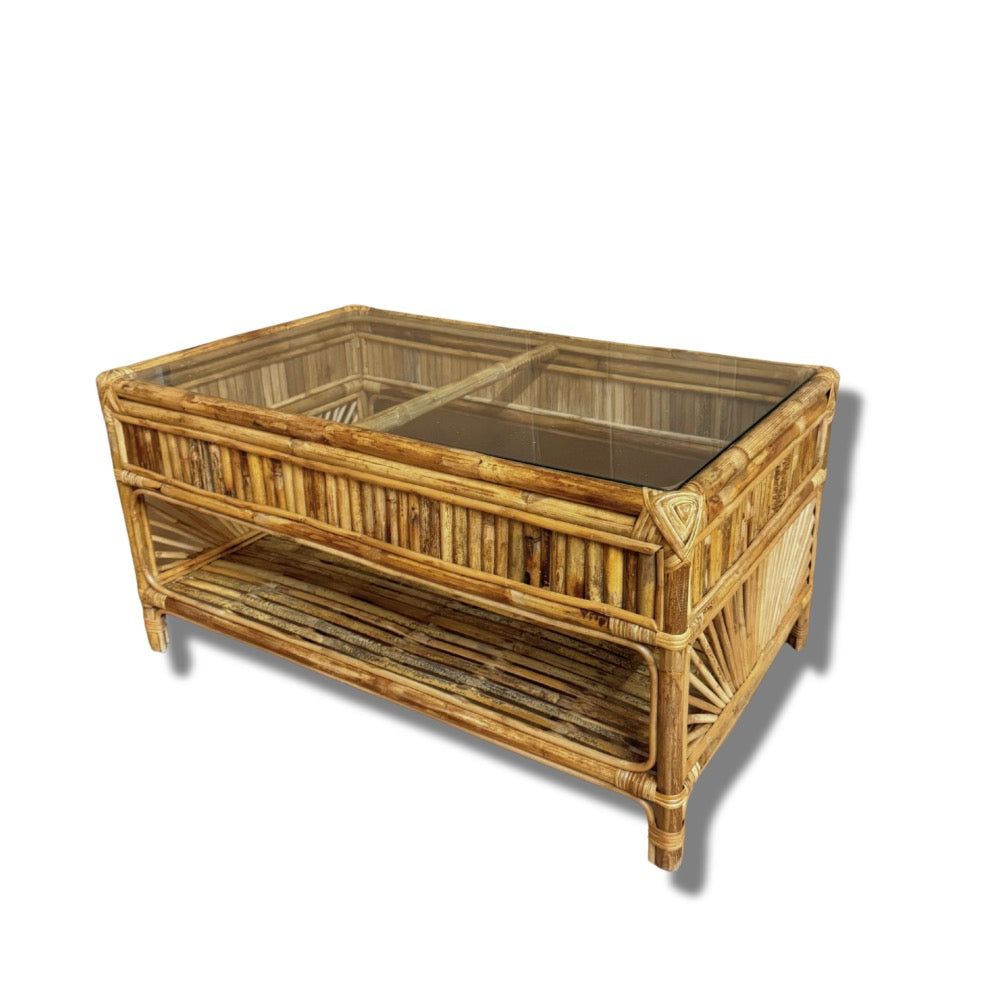 Wicker coffee table with glass top on a white background