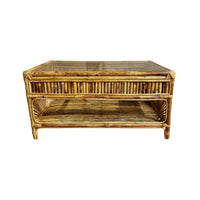 Rattan coffee table with glass top on a white background