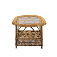 Wicker side table with glass top on a white background