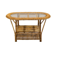 Wicker coffee table with glass top on a white background