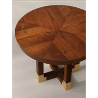 Wooden round table with a star pattern on a plain background