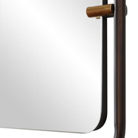 Close-up of a mirror with a wooden frame on a white background