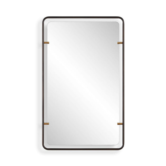 A rectangular wall mirror with a slim dark frame and small gold-toned corner accents, shown against a plain white background.