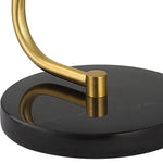 Uttermost Black + Gold Desk Lamp features a gold metal rod and black marble base for a stylish, modern accent.