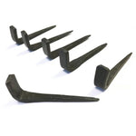 Set of black metal hooks on a white background
