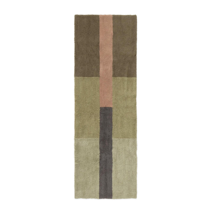 A rectangular area rug with a modern geometric block pattern in muted earthy tones, including olive green, brown, dusty pink, and charcoal gray, shown flat against a white background.