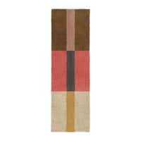 A rectangular area rug with a mid-century modern color-blocked pattern, featuring sections of brown, dusty pink, coral red, charcoal gray, cream, and mustard yellow on a white background.