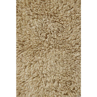 small fluffy beige pelt rug wool recycled cotton rounded edges